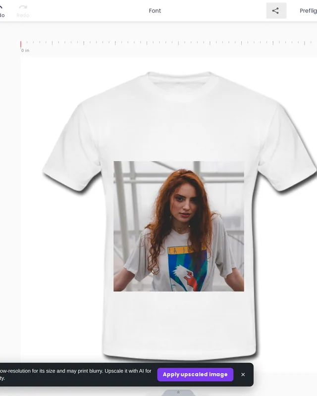 A portrait photo with a grey background placed on a white t-shirt in the designer