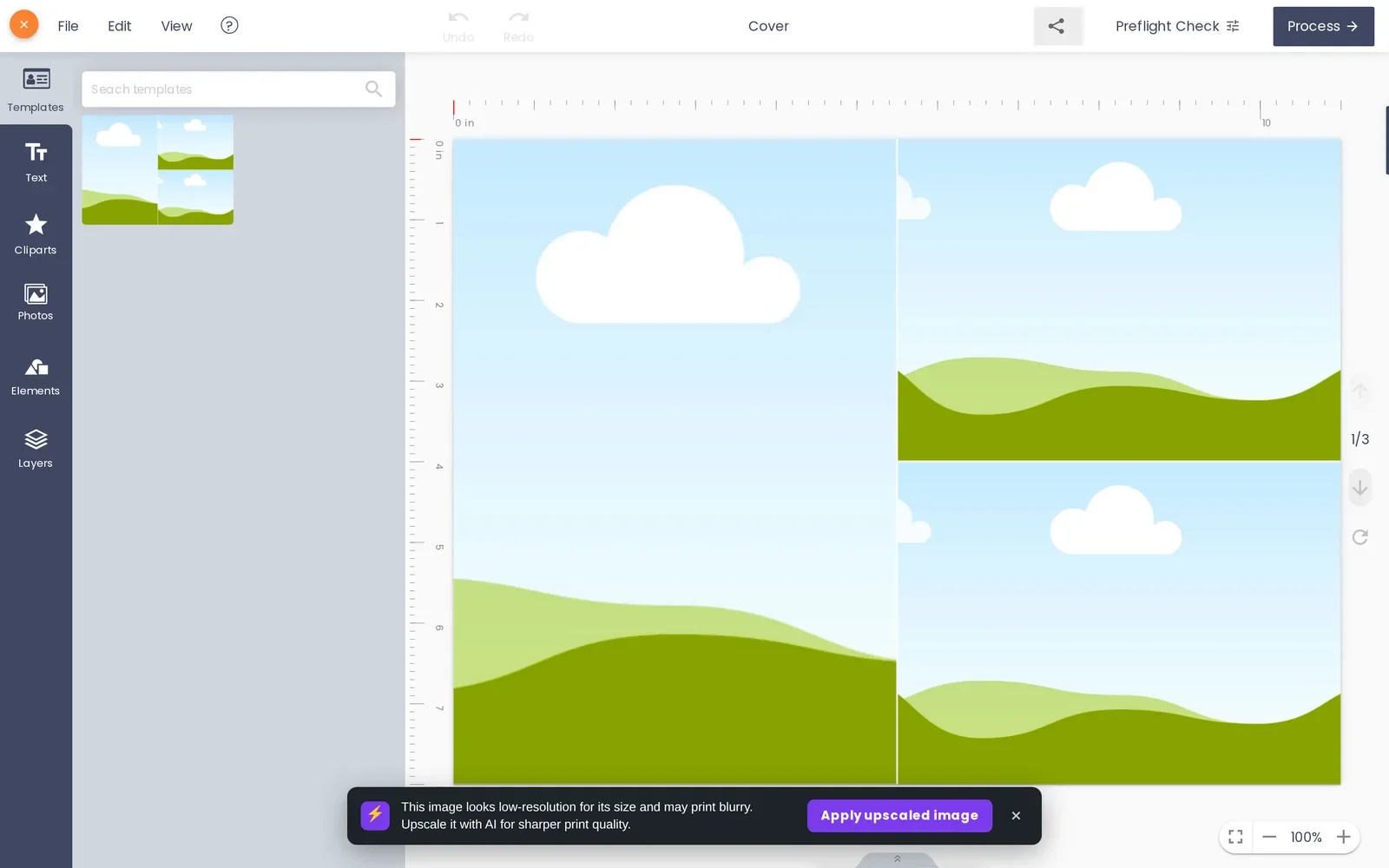 Online photo book designer with a cover template loaded, showing pages and a low-resolution image warning